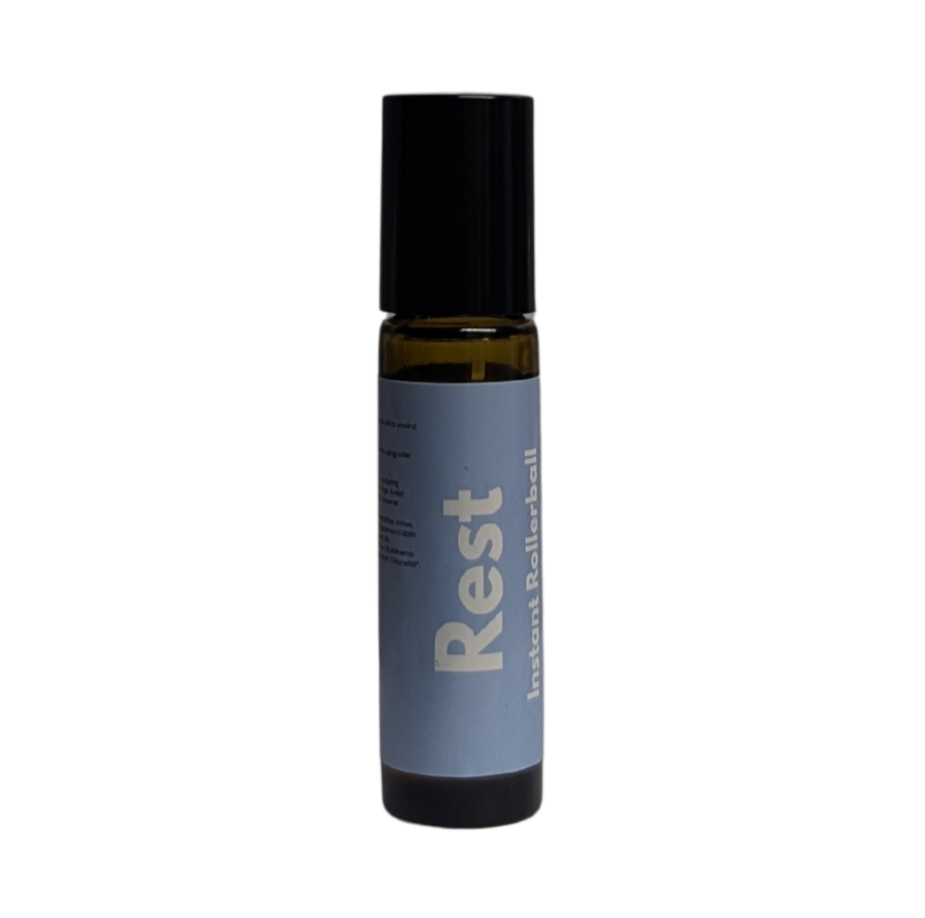 Pepperfit Rest Instant Rollerball in a small amber glass bottle with a blue label.
